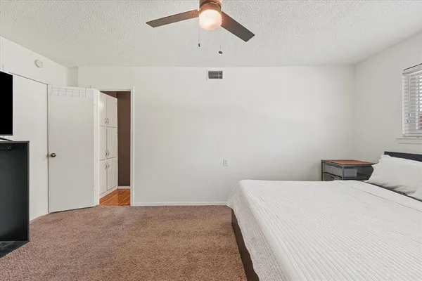 a living room with a couch and a table with wooden floor