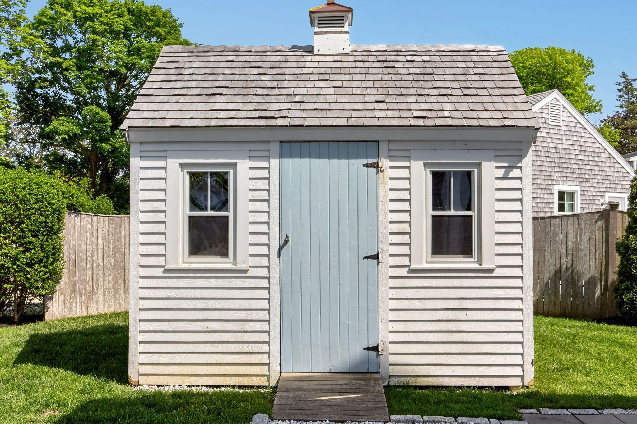 320 Old Harbor Road Chatham, MA 02633 - Photo 6 of 58 a view of a house with a yard and a garage