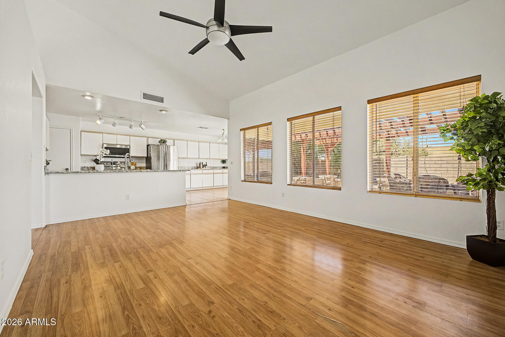 2762 North Ricardo Mesa, AZ 85215 - Photo 13 of 38 a view of an empty room with a window and wooden floor