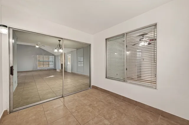 a view of an empty room with a fireplace