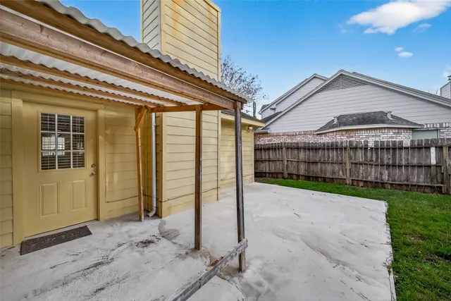 a view of backyard with a garden and deck