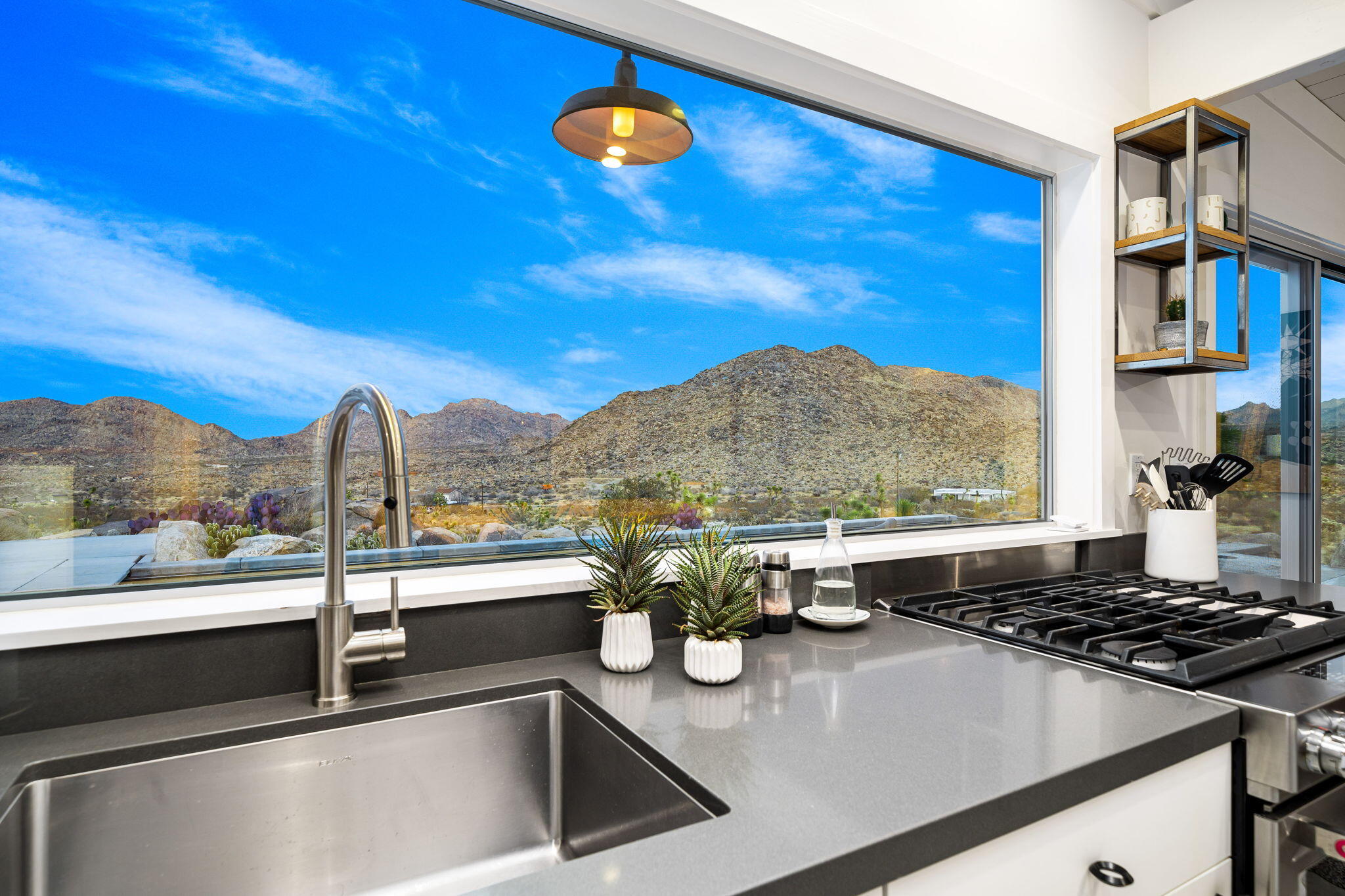 8269 Vía Rocosa Joshua Tree, CA 92252 - Photo 13 of 74 a kitchen with a stove and a sink