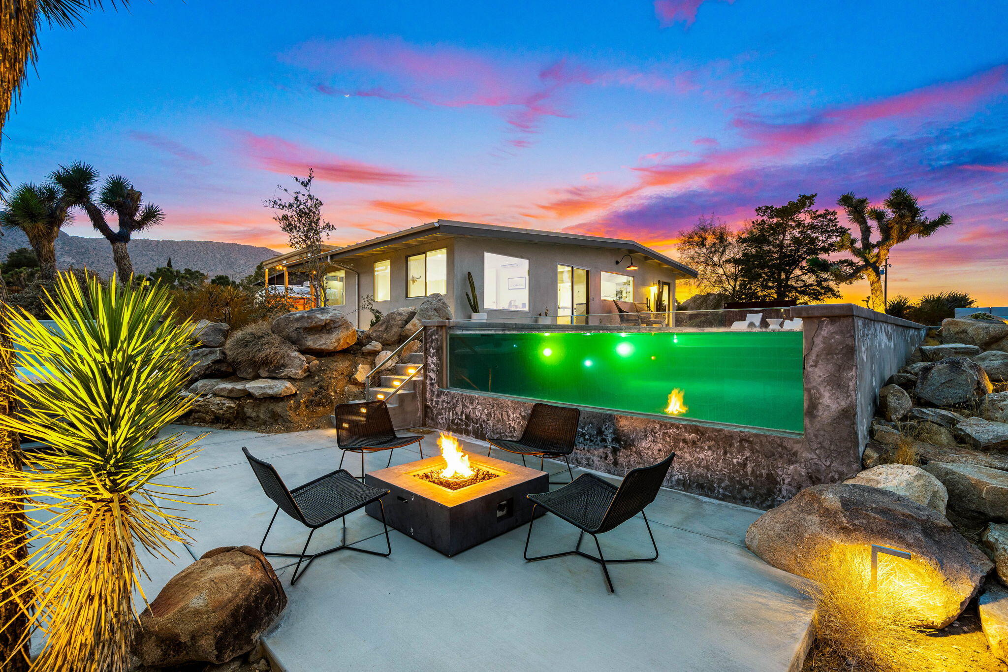 8269 Vía Rocosa Joshua Tree, CA 92252 - Photo 2 of 74 a view of a backyard with swimming pool and furniture