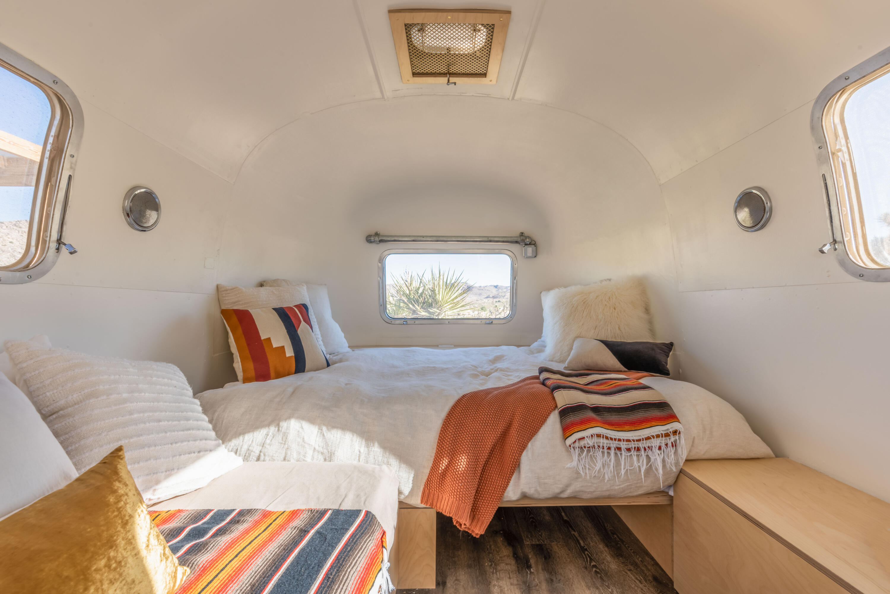 8269 Vía Rocosa Joshua Tree, CA 92252 - Photo 28 of 74 a bedroom with a bed and wooden floor