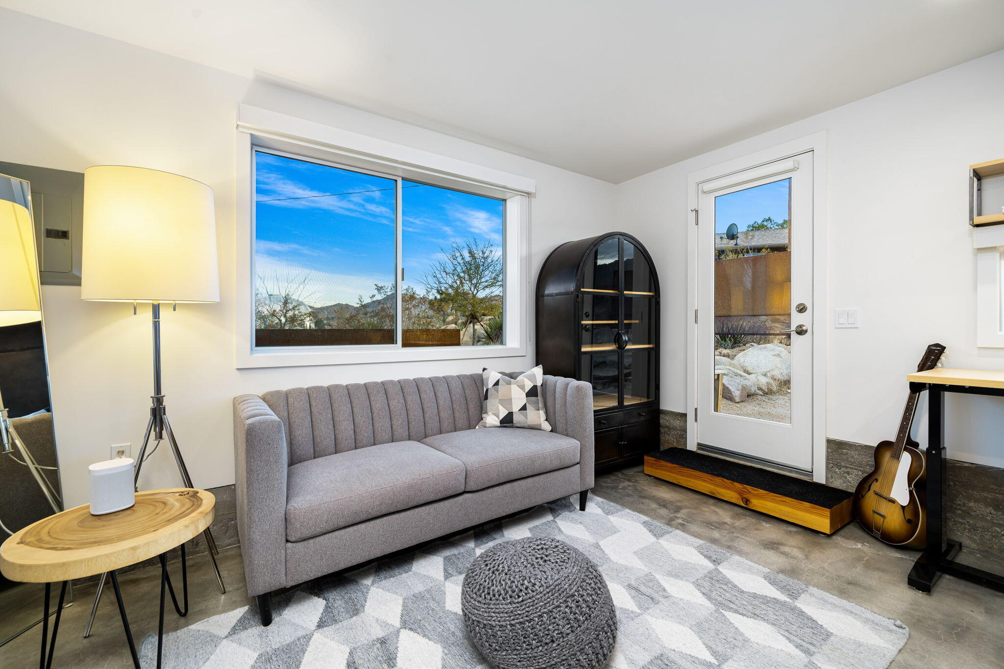 8269 Vía Rocosa Joshua Tree, CA 92252 - Photo 35 of 74 a living room with furniture and a window