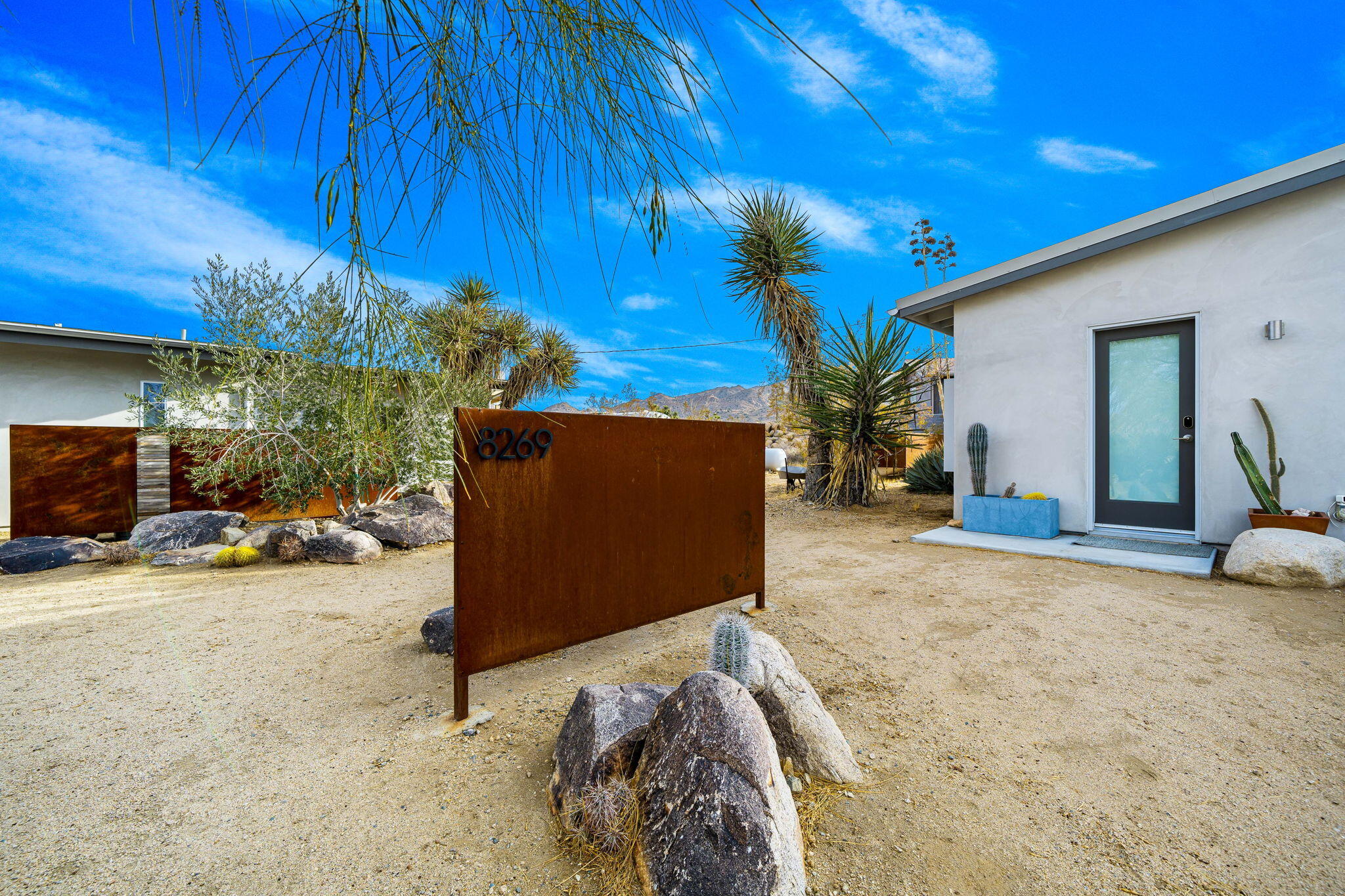 8269 Vía Rocosa Joshua Tree, CA 92252 - Photo 48 of 74 a view of a house with a patio