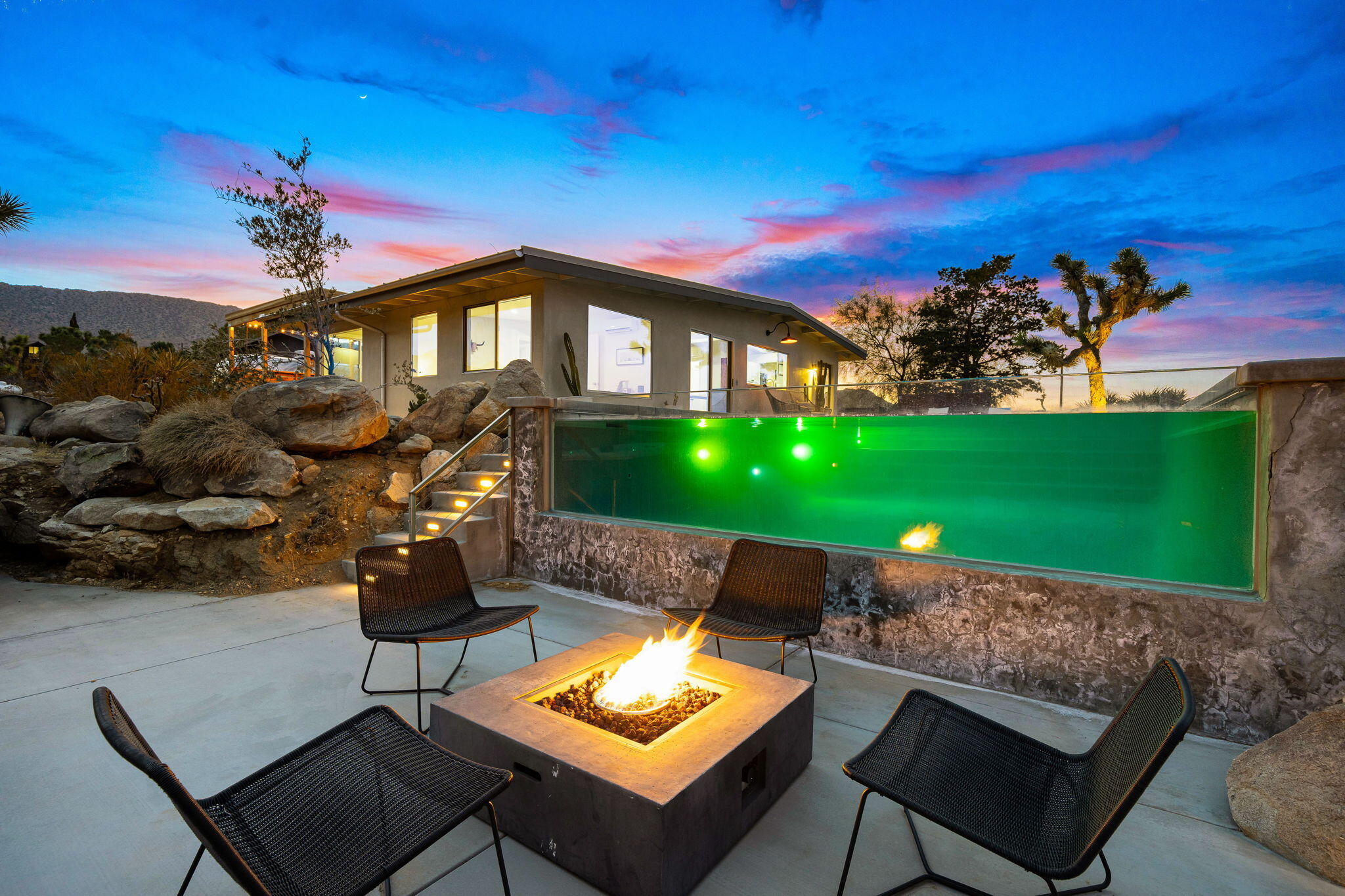 8269 Vía Rocosa Joshua Tree, CA 92252 - Photo 68 of 74 a front view of a house with garden