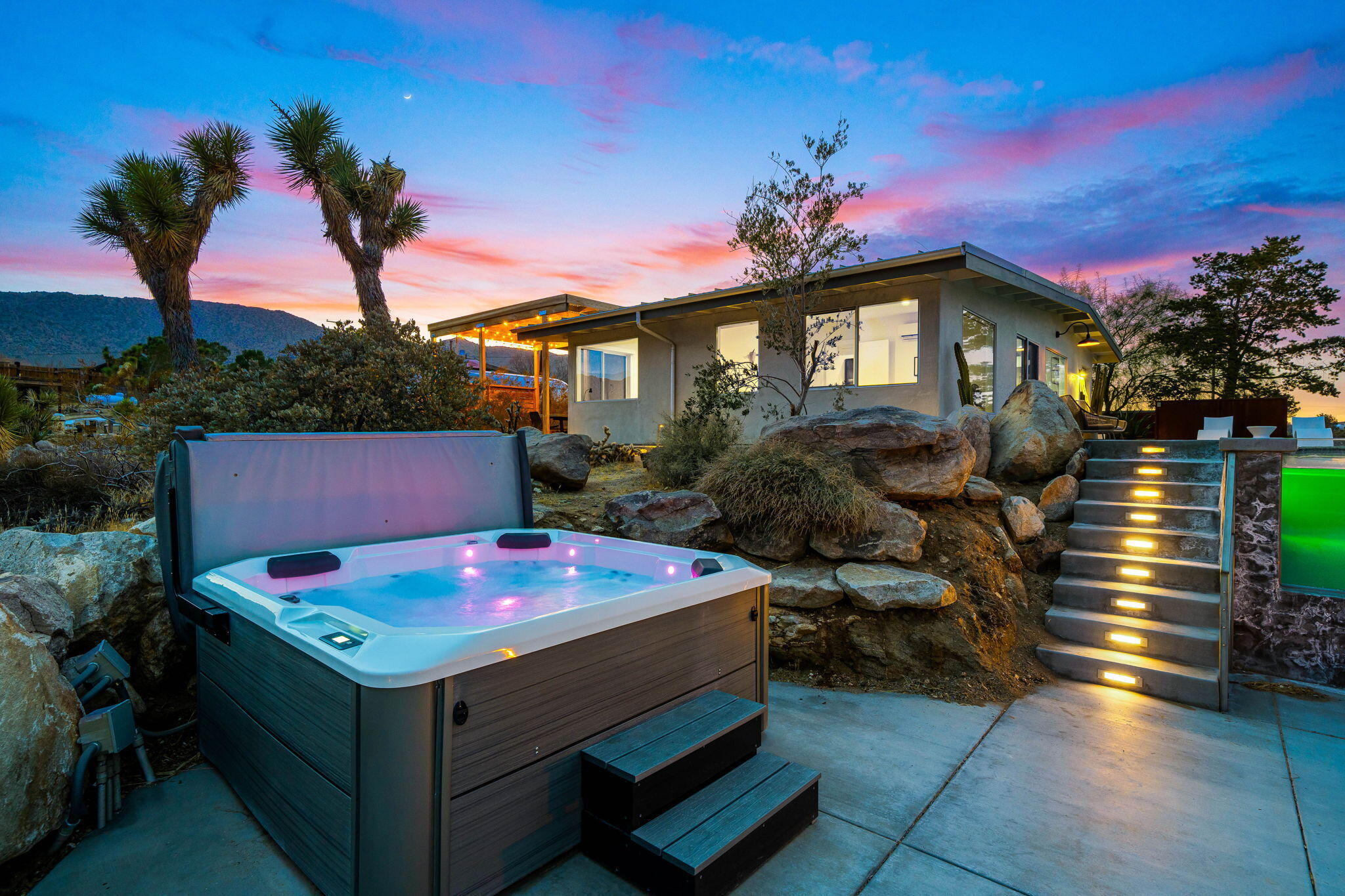 8269 Vía Rocosa Joshua Tree, CA 92252 - Photo 69 of 74 a front view of a house with yard