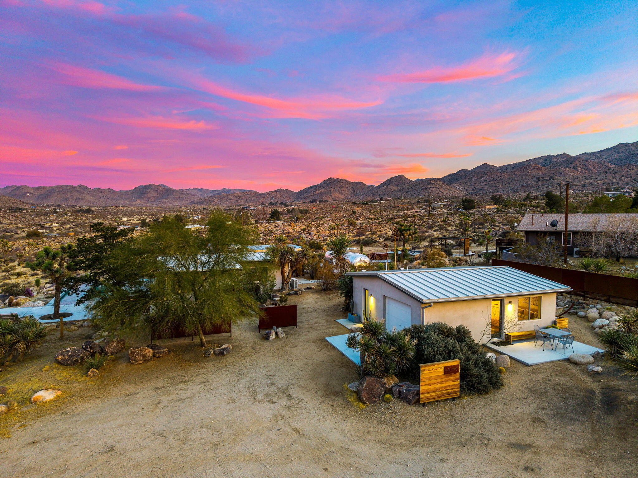8269 Vía Rocosa Joshua Tree, CA 92252 - Photo 72 of 74 a view of a town with couple of houses