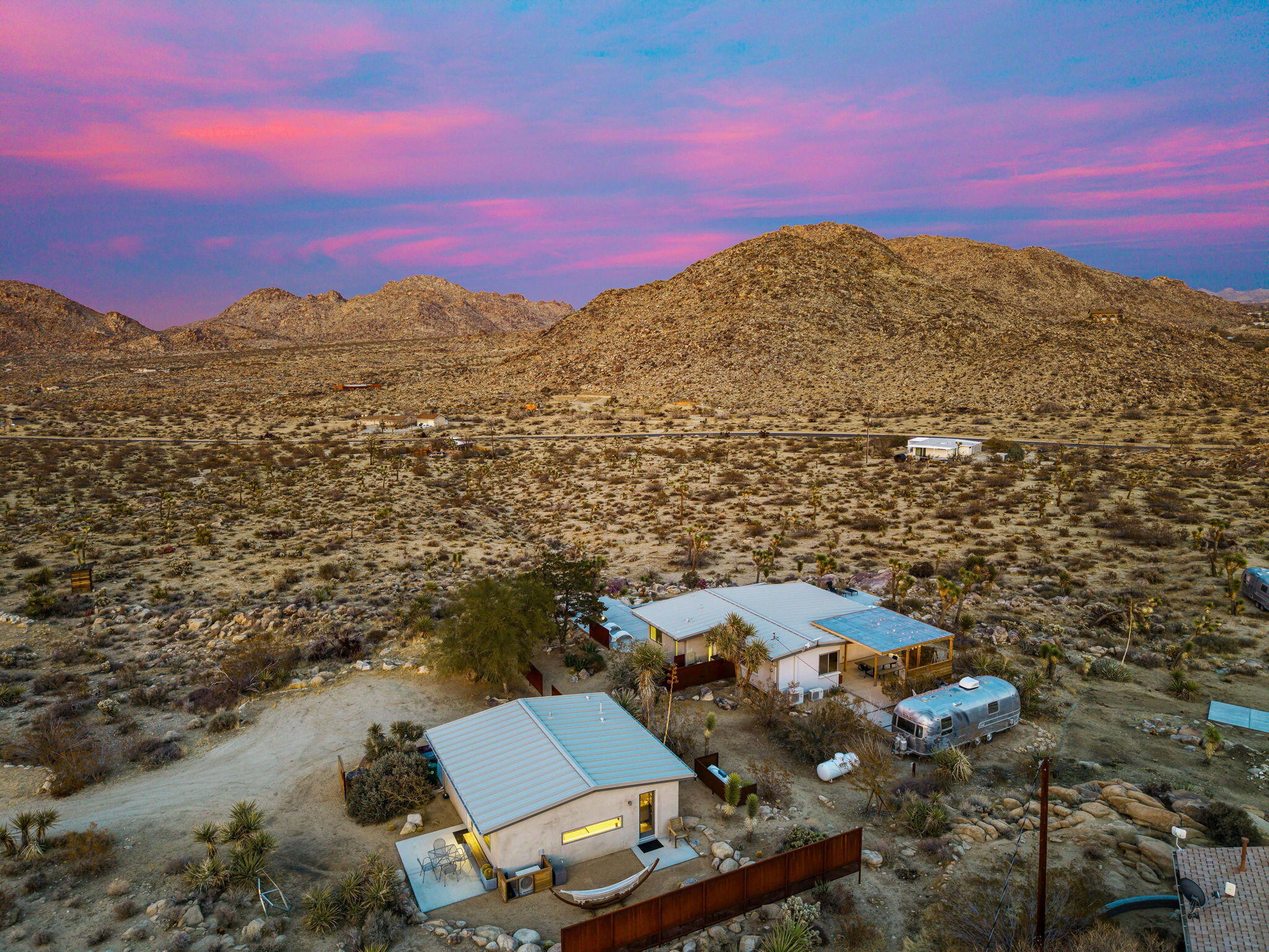 8269 Vía Rocosa Joshua Tree, CA 92252 - Photo 73 of 74 an aerial view of residential houses with outdoor space