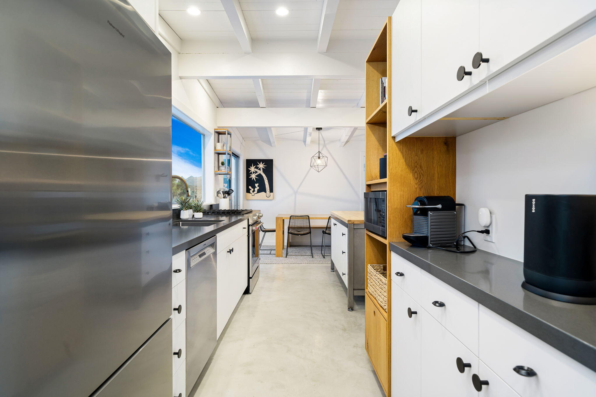 8269 Vía Rocosa Joshua Tree, CA 92252 - Photo 8 of 74 a large kitchen with a large counter top appliances and cabinets