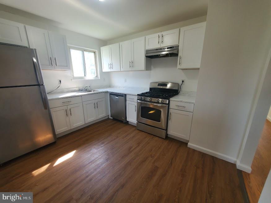 250 Purdue Avenue Pemberton, NJ 08068 - Photo 2 of 23 a kitchen with a sink a stove a refrigerator and cabinets
