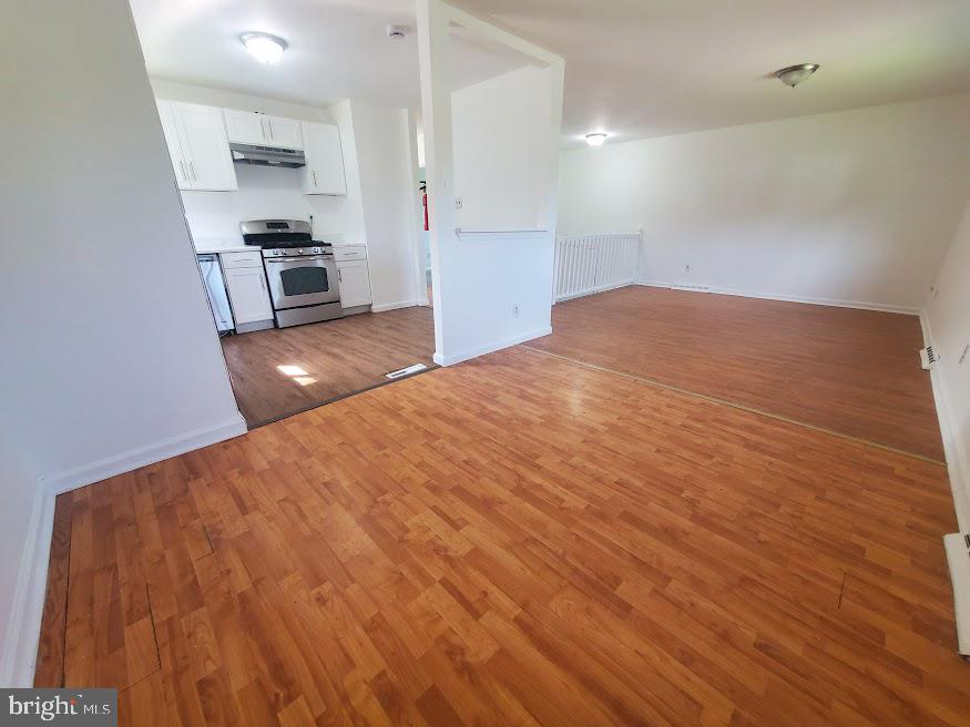 250 Purdue Avenue Pemberton, NJ 08068 - Photo 4 of 23 a view of kitchen and empty room with wooden floor