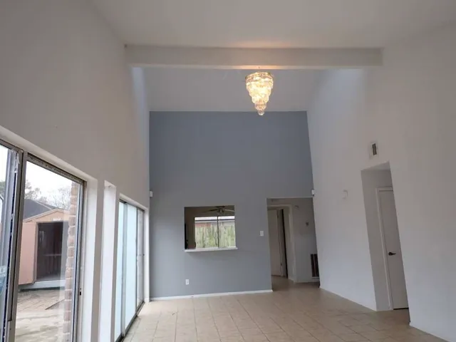 a view of empty room with windows