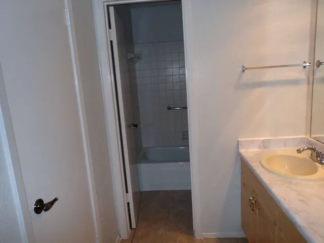 a bathroom with a sink and shower