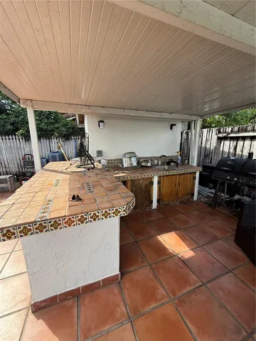 a kitchen with a table and chairs in it