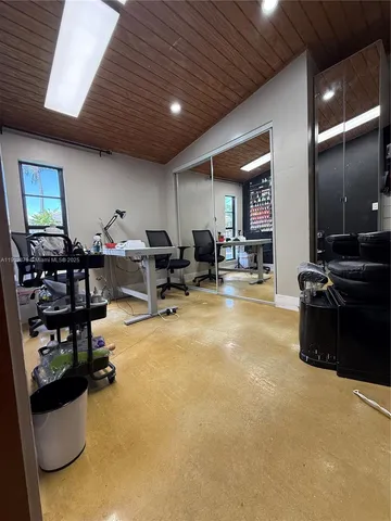 a living room with lots of furniture and black countertop