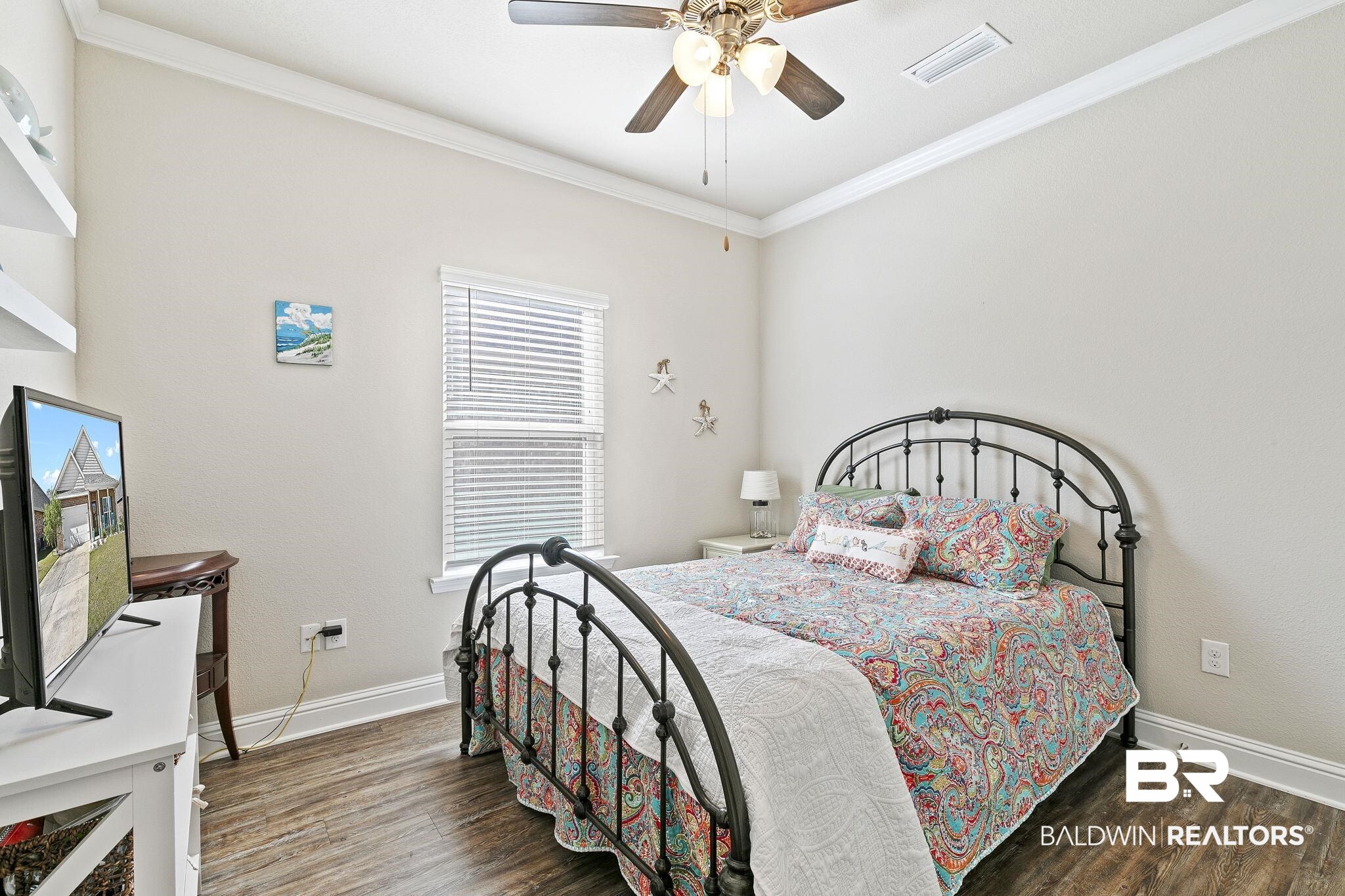 1319 Kairos Loop Foley, AL 36535 - Photo 30 of 64 Bedroom with ceiling fan, dark hardwood / wood-style floors, and crown molding