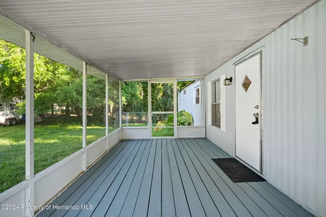 a view of porch with wooden floor and outdoor space