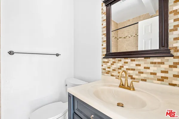 a bathroom with a sink and a toilet