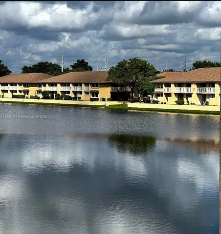 an aerial view of a residential houses with lake view