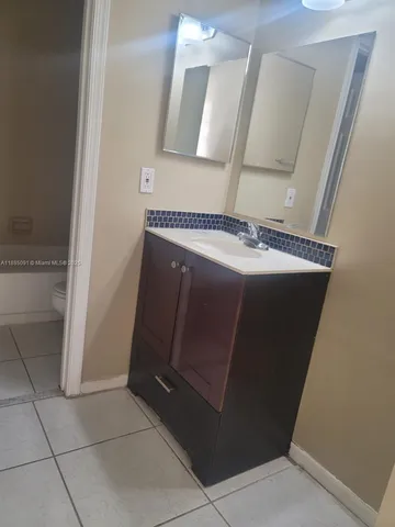 a view of a hallway with washer and dryer