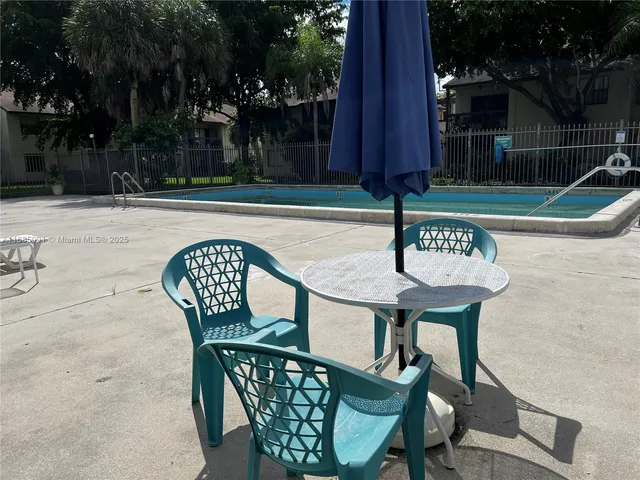 a wooden bench sitting in front of a building