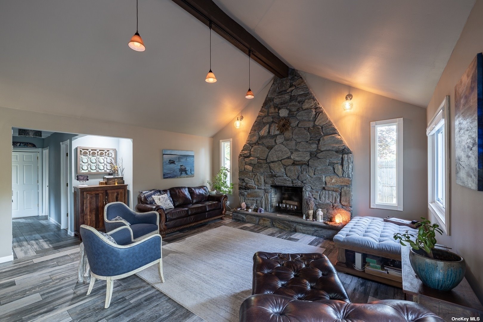 a living room with furniture and a fireplace