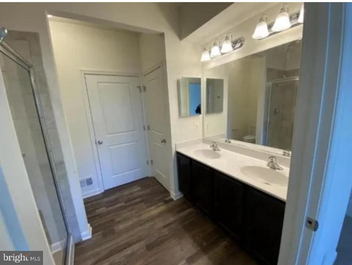 116 Trails Way Joppa, MD 21085 - Photo 10 of 45 a bathroom with a sink a mirror and a shower