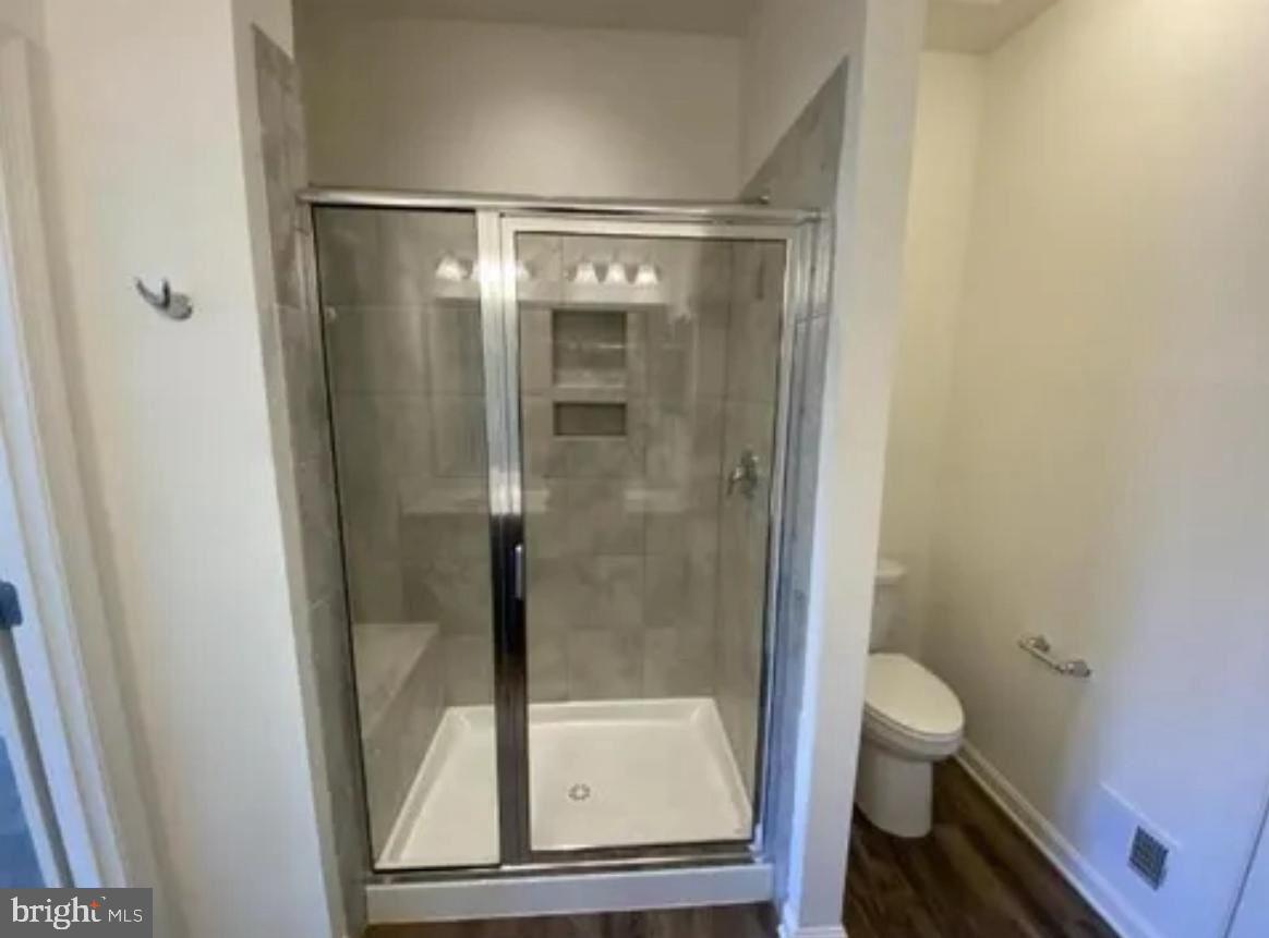 116 Trails Way Joppa, MD 21085 - Photo 11 of 45 a bathroom with a glass shower door