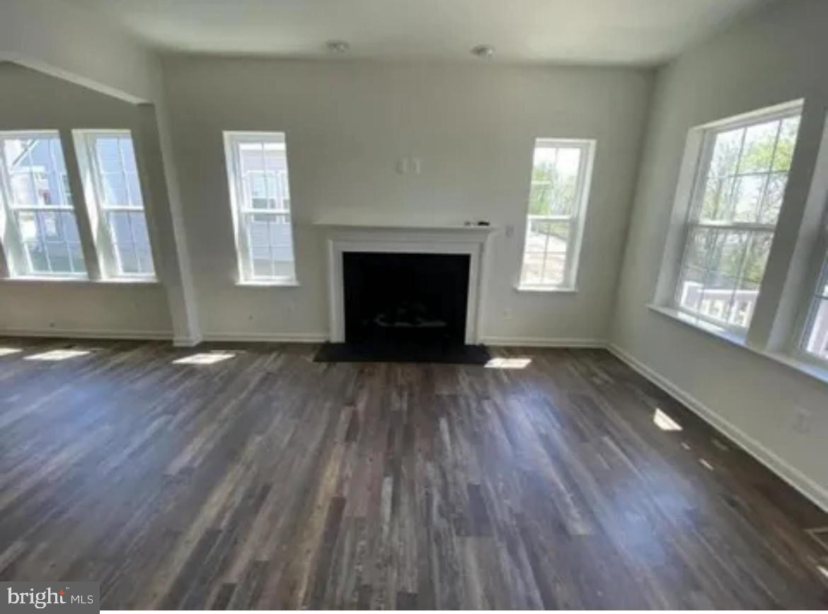 116 Trails Way Joppa, MD 21085 - Photo 13 of 45 wooden floor fireplace and windows in an empty room