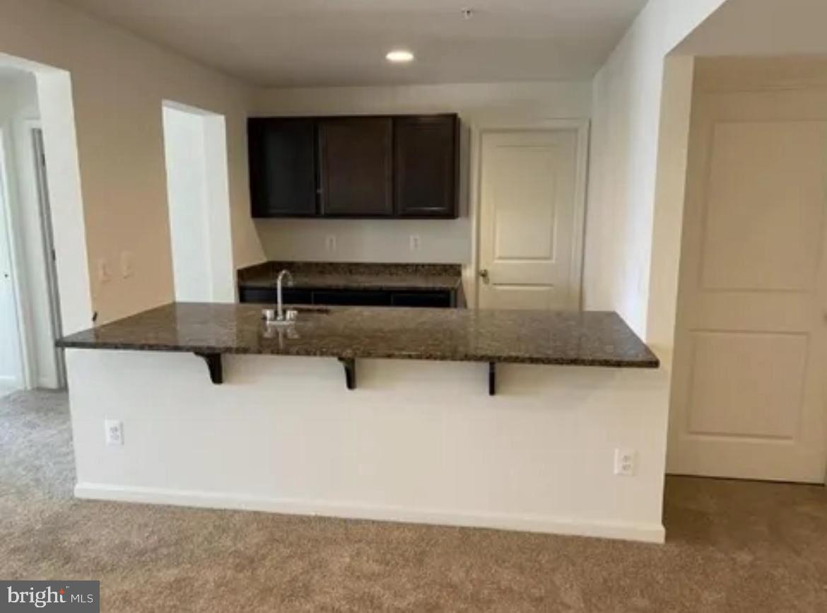 116 Trails Way Joppa, MD 21085 - Photo 17 of 45 a view of kitchen island with stainless steel appliances granite countertop cabinets and a counter top space