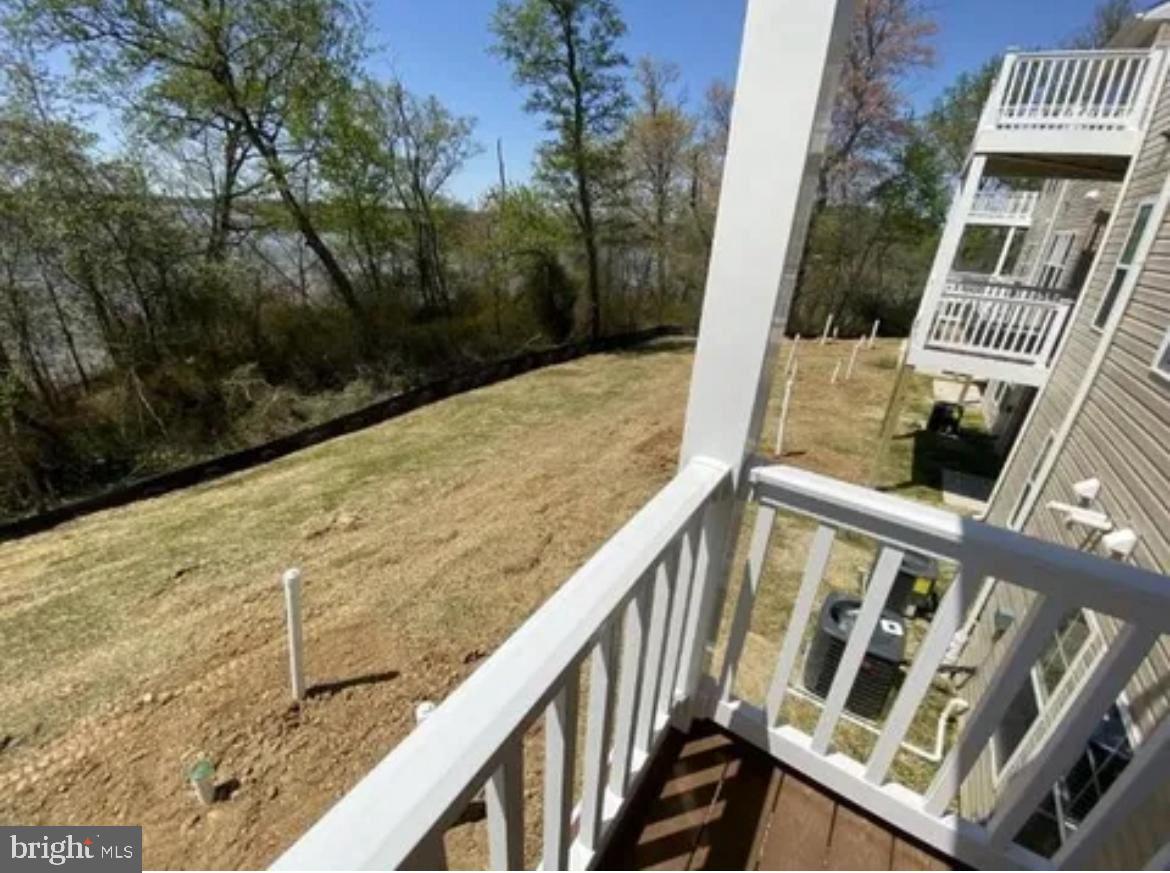 116 Trails Way Joppa, MD 21085 - Photo 33 of 45 a view of balcony with wooden floor and fence