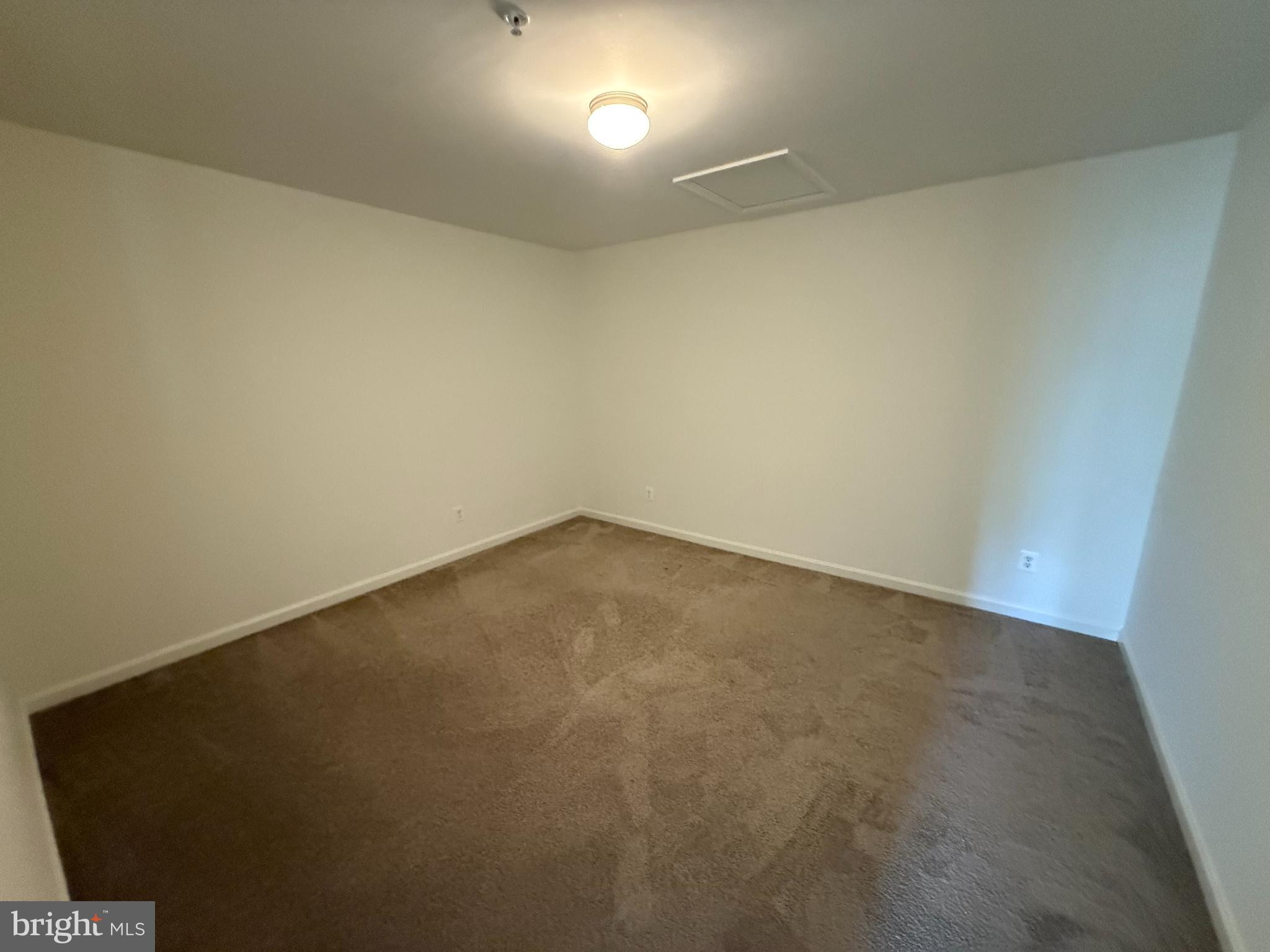 116 Trails Way Joppa, MD 21085 - Photo 5 of 45 an empty room with a workbench