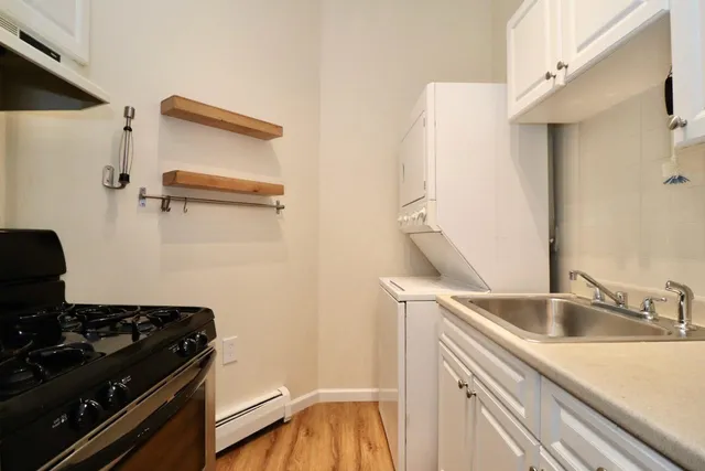 a kitchen with a sink and a stove