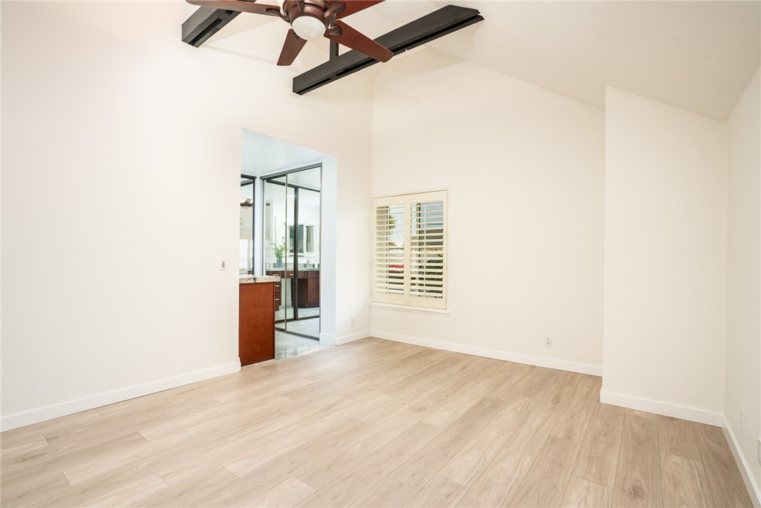 2007 Delaware Street Huntington Beach, CA 92648 - Photo 17 of 36 Downstairs Primary Bedroom w/vaulted & beamed ceilings!
