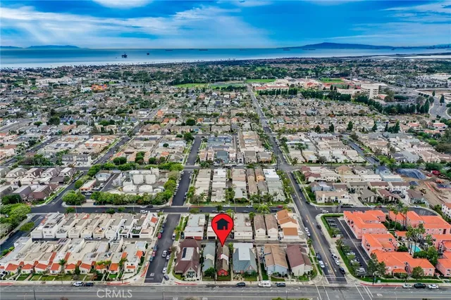 an aerial view of a house with a yard