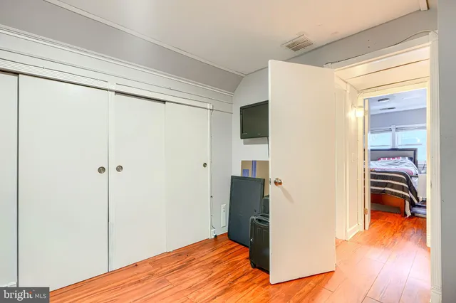 a bathroom with a sink vanity and a mirror