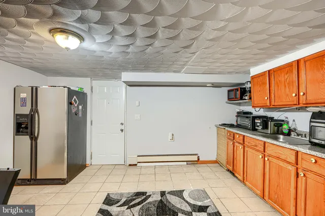 a kitchen with a sink cabinets and window