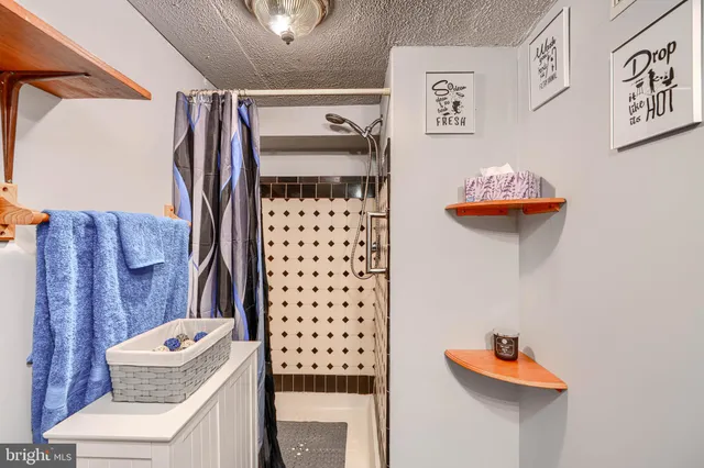 a view of balcony with wooden floor and fence