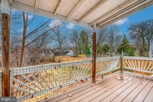 a view of a balcony with wooden floor