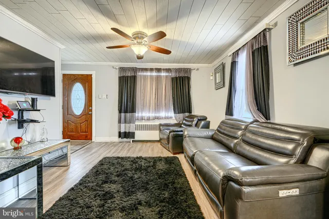a living room with furniture fireplace and a flat screen tv