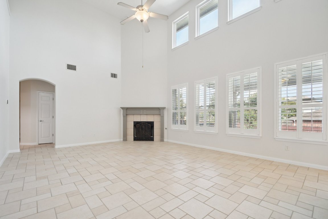 12421 Gun Metal Drive Austin, TX 78739 - Photo 11 of 40 a view of an empty room with a fireplace
