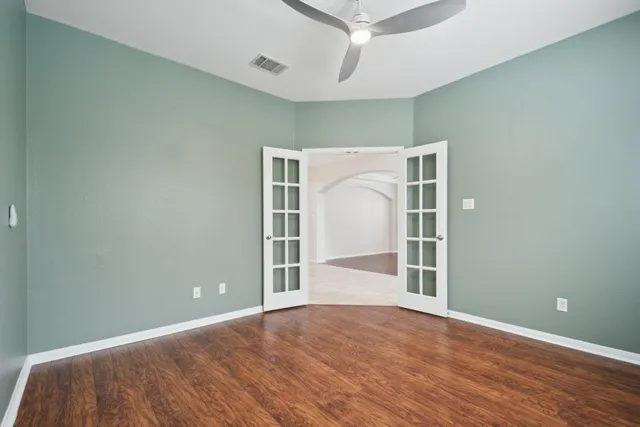 a view of an empty room with a window