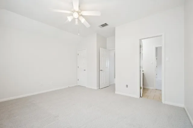 a view of a fountain in front of a house