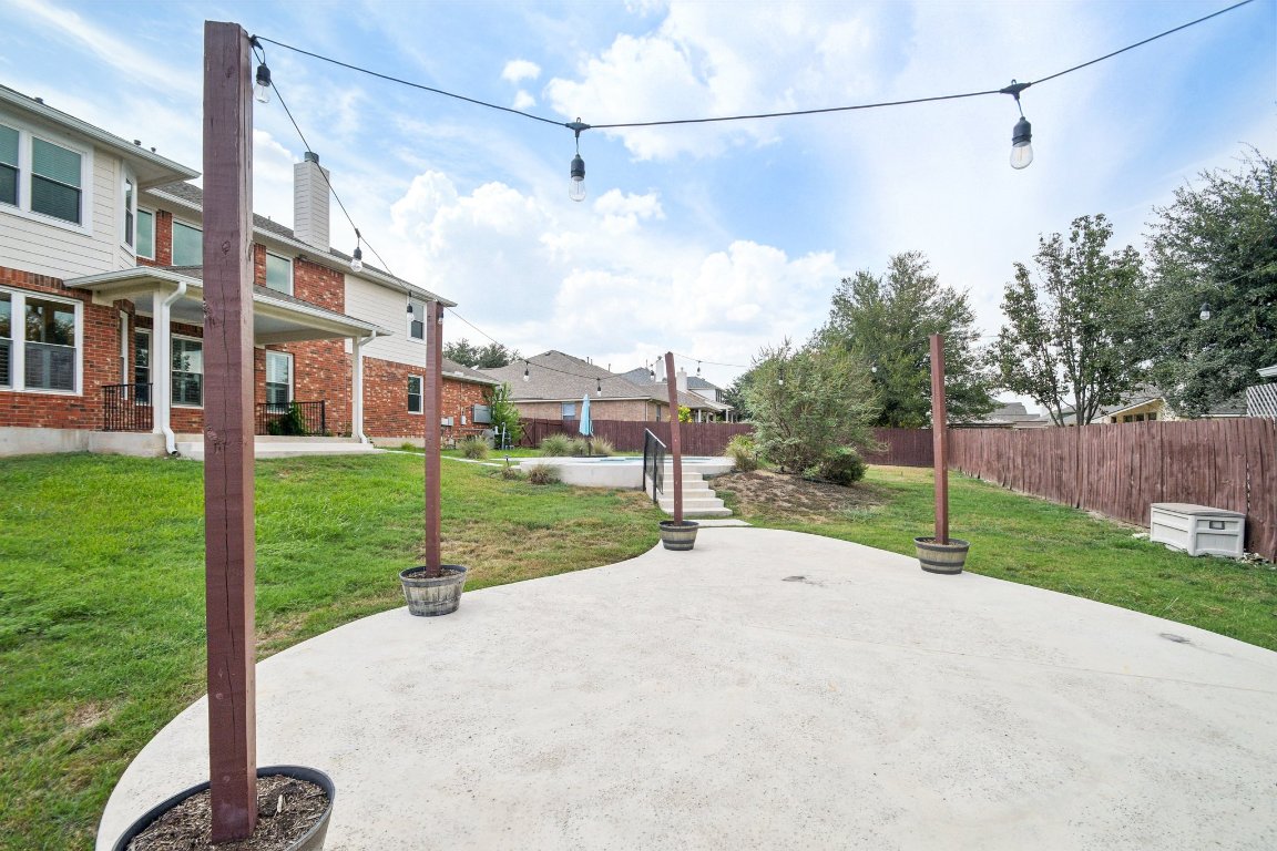 12421 Gun Metal Drive Austin, TX 78739 - Photo 38 of 40 a view of a street with a big yard and large trees