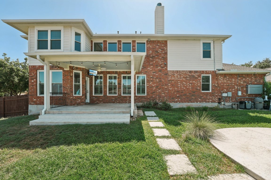 12421 Gun Metal Drive Austin, TX 78739 - Photo 40 of 40 a front view of a house with a yard