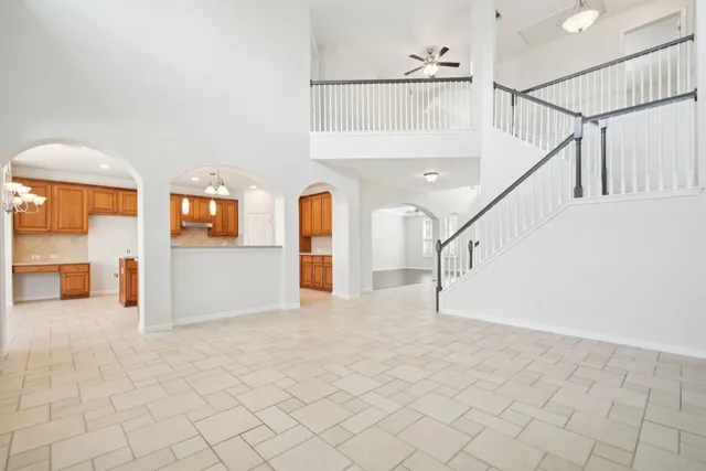 a view of an empty room with a fireplace