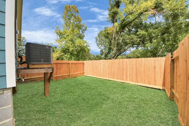 a backyard of a house with lots of green space