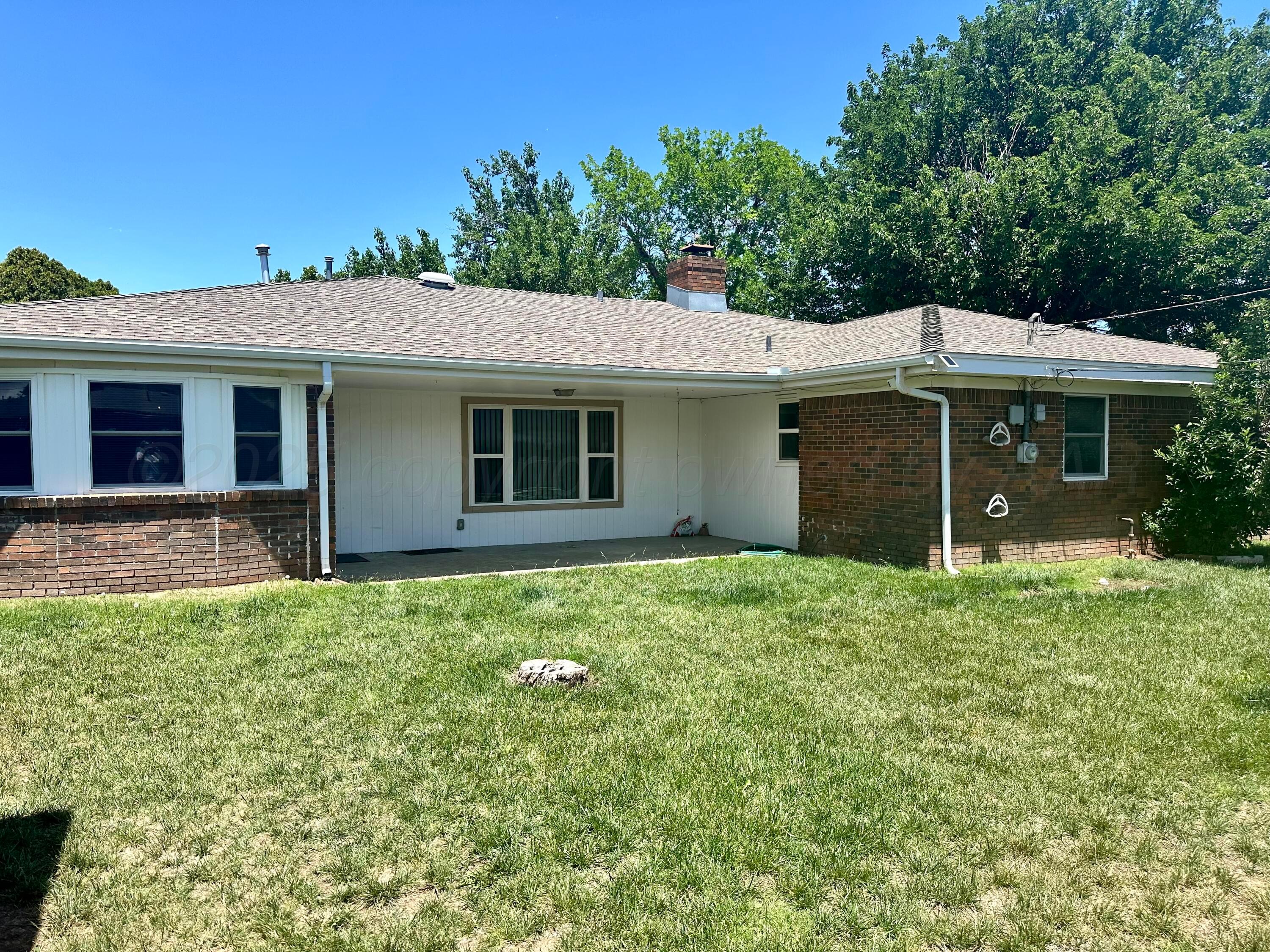 6007 Palmetto Trail Amarillo, TX 79106 - Photo 23 of 23 a front view of a house with a garden